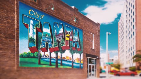 TAMPA, FL - MAY 27: (Timelapse) Tampa, Florida downtown city mural public artwork sign on May 27, 2017. Tampa ranks as the 5th most popular American city, according to a 2009 Pew Research Center study