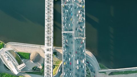 Aerial top down view shot of traffic jam on a car bridge in the evening rush hour. 4K video