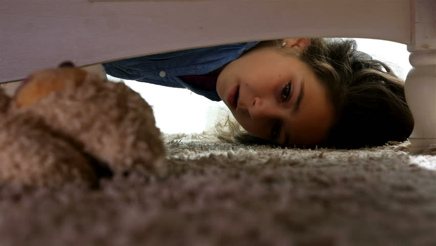 The teddy is under the bed