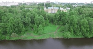 4K aerial drone video with view of beautiful vintage architecture of Ivanovskoye Estate, views of main house, Pahra River and park in outskirts of Podolsk town in central Russia, south of Moscow