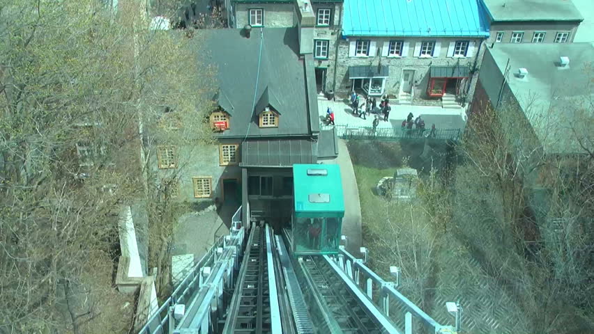 Quebec City Canada view from riding the funicular from the walled city to the old lower city.  The shot has a blue cast from the tinted windows, and some window reflection.