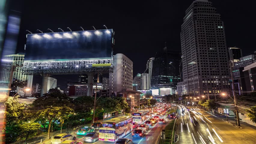 4K resolution Timelapse Cinemagraph, The Big blank billboard beside the road at night, Advertising background for add your text promotion or product in scene traffic communication Royalty-Free Stock Footage #27222178
