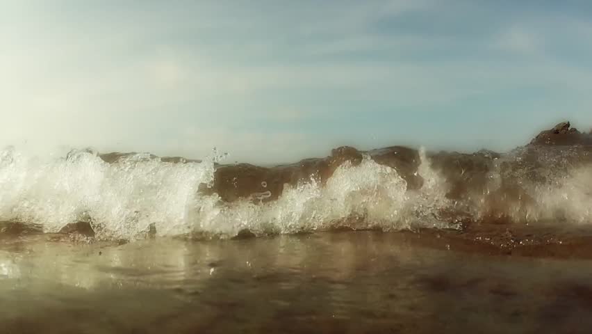 Waves break on the ocean shore