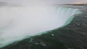 Niagara Falls view from the top. Close up of the beautiful horse shoe fall at Niagara, from the Canadian side. Slow motion video. Very famous and majestic destination
