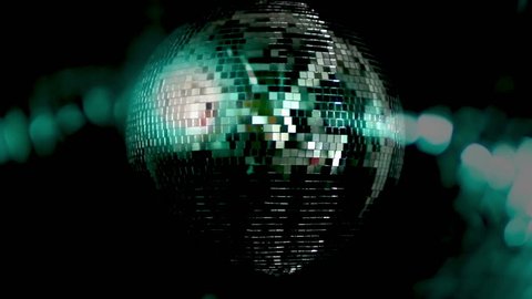 a funky discoball spinning and reflecting light. perfect clip for club visuals or party/celebration