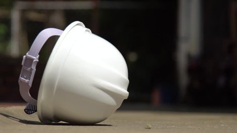 Slow motion : Helmet safety falling down on the floor,This video used for safety concept and with copy space 