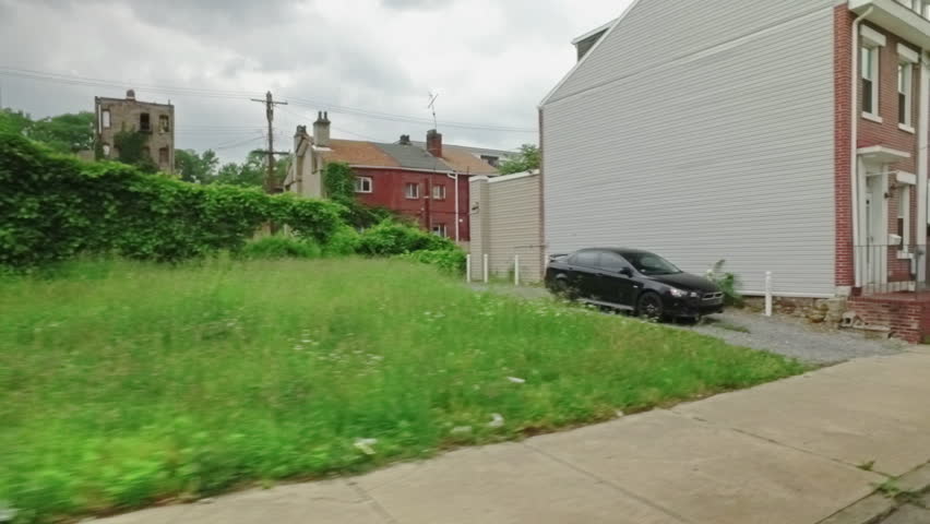 A dolly establishing shot of middle to low income row houses on Pittsburgh