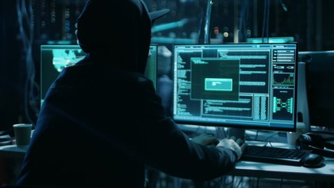 Team of Internationally Wanted Teenage Hackers Infect Servers and Infrastructure with Ransomware. Their Hideout is Dark, Neon Lit and Has Multiple Displays. Shot on RED EPIC-W 8K Helium Cinema Camera.
