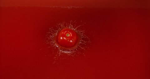 Cherry Tomatoe, solanum lycopersicum, Fruit falling into tomatoe's Juice, Slow Motion 4K
