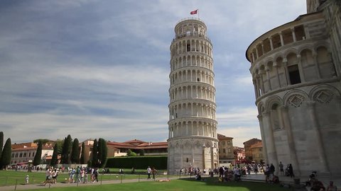 Pisa, May 2017: Tourists in Square of Miracles (Piazza dei Miracoli ) with the famous Leaning tower and the Cathedral, on May 2017 in Pisa