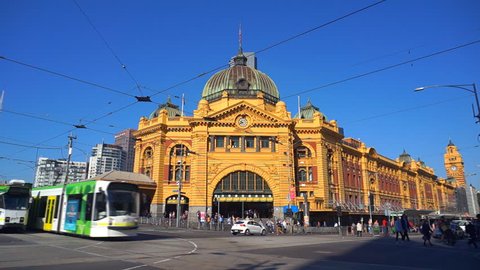Melbourne, Australia - April, 4, 2017: Flinders street station intersection with trams and cars crossing