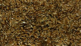 Great background of Organic flax seeds rotating close up. Footage will work great for any videos dealing with cooking, health nutrition and much more.