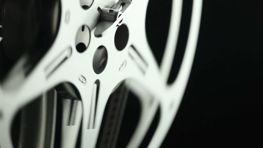 Film reel of an 8mm vintage Projector and black background