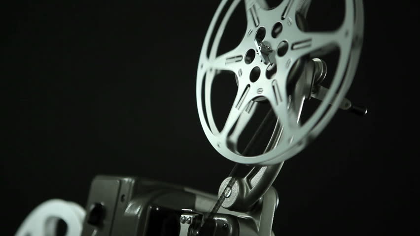 Film reel of an 8mm vintage Projector and black background