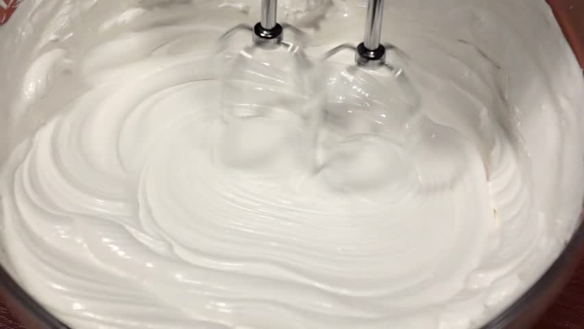 Mixing white cream in glass plate with mixer, slow motion | Shutterstock HD Video #27290008