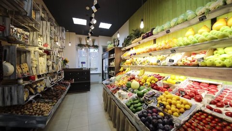 Turning light off and on in shop with vegetables, fruits, Text translation - Tomatoes, cucumbers, mix, cabbage, plump