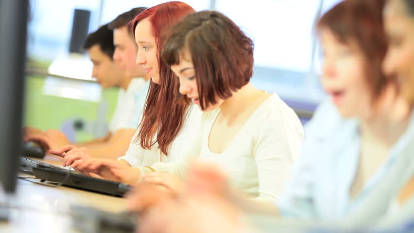 Workshop male and female multi ethnic students using university education net applications on computer online | Shutterstock HD Video #2731115