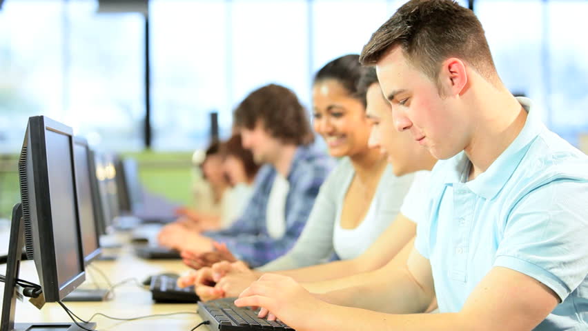 Portrait of Caucasian male university student using modern IT communication in group multi ethnic classmates in technology room | Shutterstock HD Video #2731238