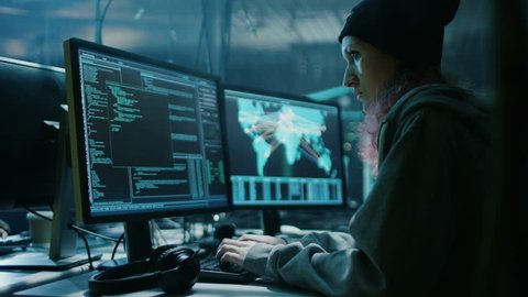 Nonconformist Teenage Hacker Girl Organizes Malware Attack on Global Scale. They're in Underground Secret Location Surrounded by Displays and Cables. Shot on RED EPIC-W 8K Helium Cinema Camera.