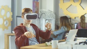 In a Computer Science Class Boy Wearing Virtual Reality Headset Works on Programing Gestures for the Project. Shot on RED EPIC-W 8K Helium Cinema Camera. - Powered by Shutterstock - Get 15% off with code: PIKWIZARD15