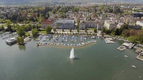 Fountain in a Sea and Luxury Marina Boats Yachts at a Port in Zurich Switzerland Aerial View Flying Over and Looking Down 4K