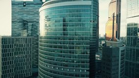 Aerial shot of reflective skyscraper details. 4K clip