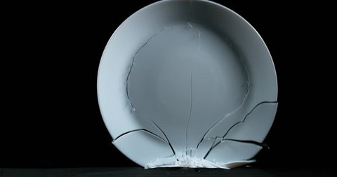 Plate falling and exploding on Black Background, Slow Motion 4K