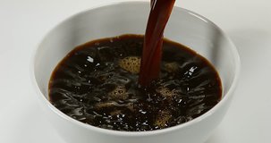Coffee Pouring into a Coffee Bowl, Slow Motion 4K