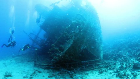 Ship wreck Gainis D and divers. Red Sea.