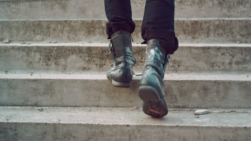 Male legs going up stairs. Man legs walking up stairs. Man in vintage shoes walking up steps. Man climbing stairs