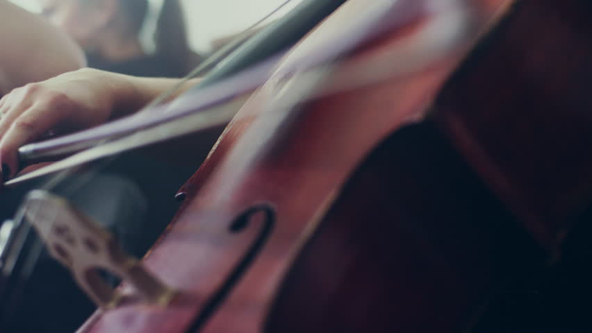 Female cello player playing violoncello. Close up of woman hand playing cello. Cello player playing cello bow. Orchestra musicians instruments | Shutterstock HD Video #27359587