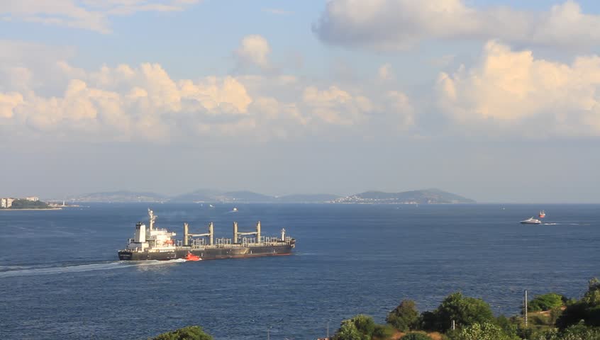 Cargo ship with a tug boat on route to Marmara Sea.
