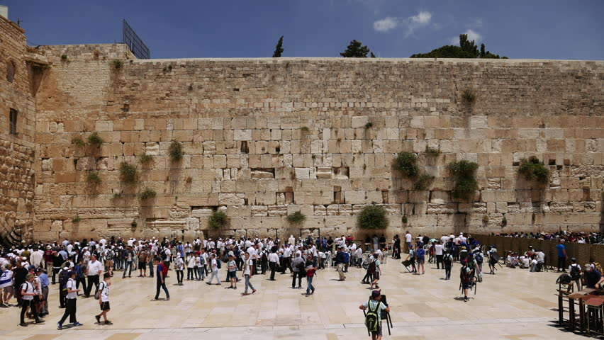 Jerusalem - May 24, 2017: Western Wall or Wailing Wall or Kotel in Jerusalem timelapse. Plenty of people come to pray to the Jerusalem western wall. The Wall is the most sacred place on the planet.