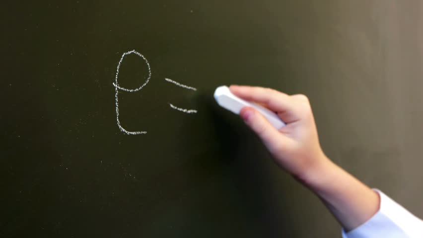 Close-up of schoolgirl writing physical formula