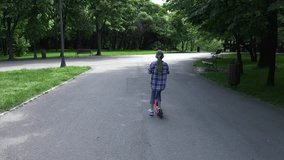 Child Riding Scooter in Park Girl Relaxing Outdoor Doing Sport Kids in Nature 4K