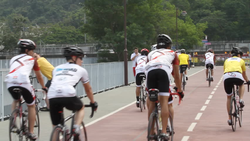 HONG KONG - NOVEMBER 5: Young people riding bicycle on bicycle lane on November