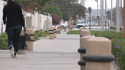 DUBAI, UAE - CIRCA 2013: View of rows of bollards or short vertical posts on a street in Dubai. Bollards control, direct or obstruct road traffic.