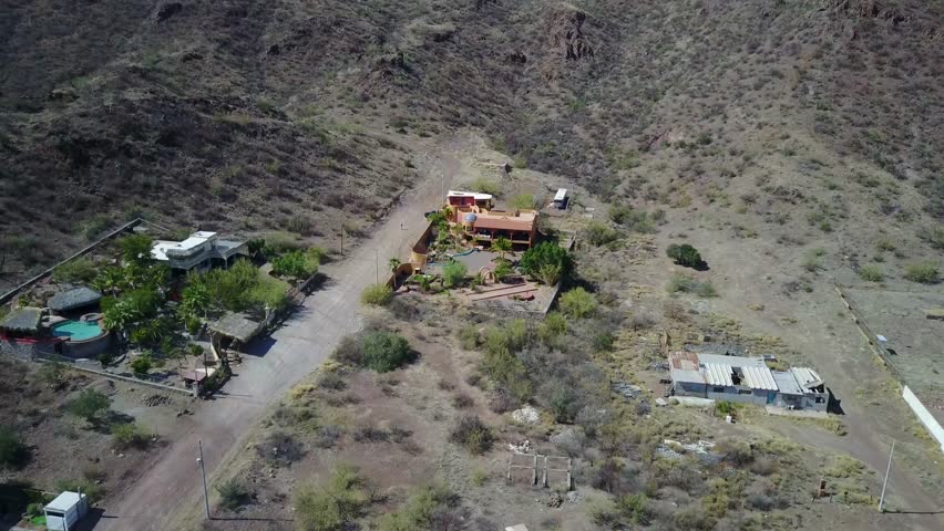 Naco, Mexico - May 10, 2017: Drone aerial view from above direct into Mexican Style House along the Arizona border