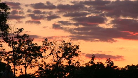 Slide sunset clouds dusk slowmotion red colors.