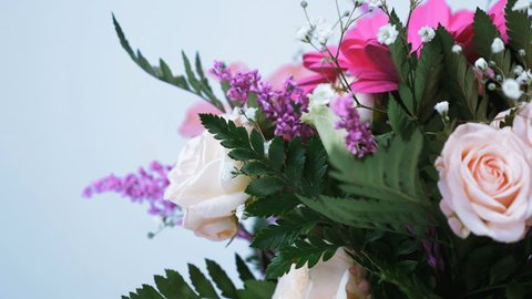 close-up. Flower bouquet, rotation on white background, floral composition consists of gerbera, Eustoma, Rose yana creamy, Alstroemeria, solidago, gypsophila Arachniodis Rose