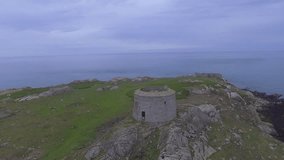 The bird view of Ireland. Aerial footage of a fly over of martello tower on Dalkey Island 