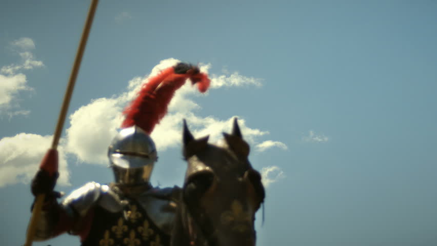 Medieval knight with lance riding horse to joust tournament Royalty-Free Stock Footage #27400399