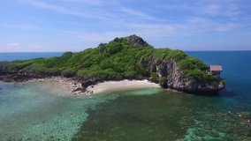Drone fly over the sea, Islands with shallow water coral at gulf of Thailand