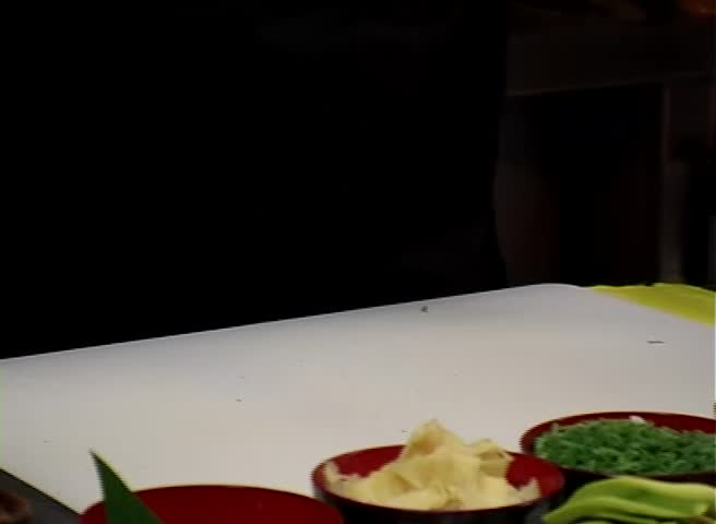 Chef slicing salmon fish