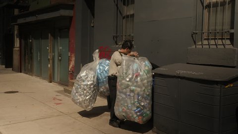 New York City, May 2017. Man collecting cans in New York City.