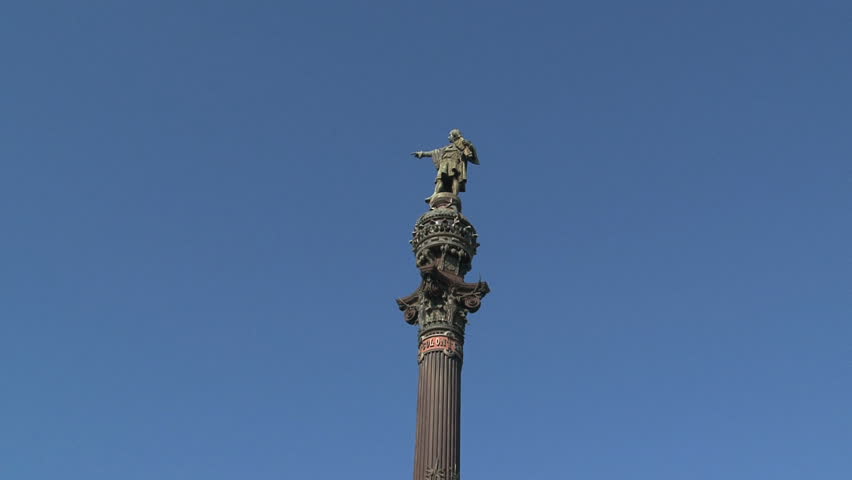 Barcelona, Spain - August 2012: Columbus Monument was built in 1888 and sits at the end of a crowded street during the day