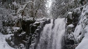 winter wonderland with cascading waterfall
