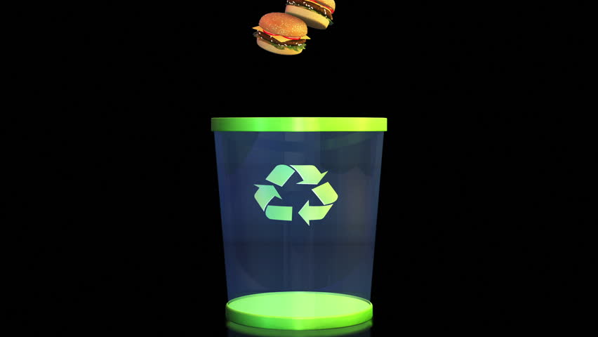 Cheeseburgers falling in a Garbage Bin against black, Dieting Concept, Alpha