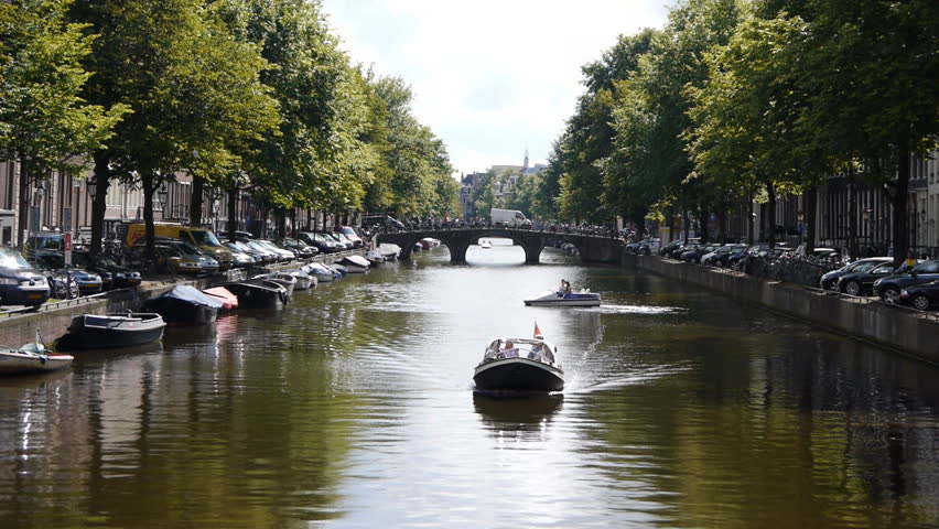 Amsterdam canal with bridge and boats