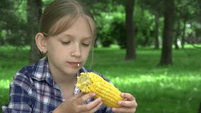Child Eating Boiled Corn Outdoor in Park, Hungry Girl Eats Healthy Snack Food 4K